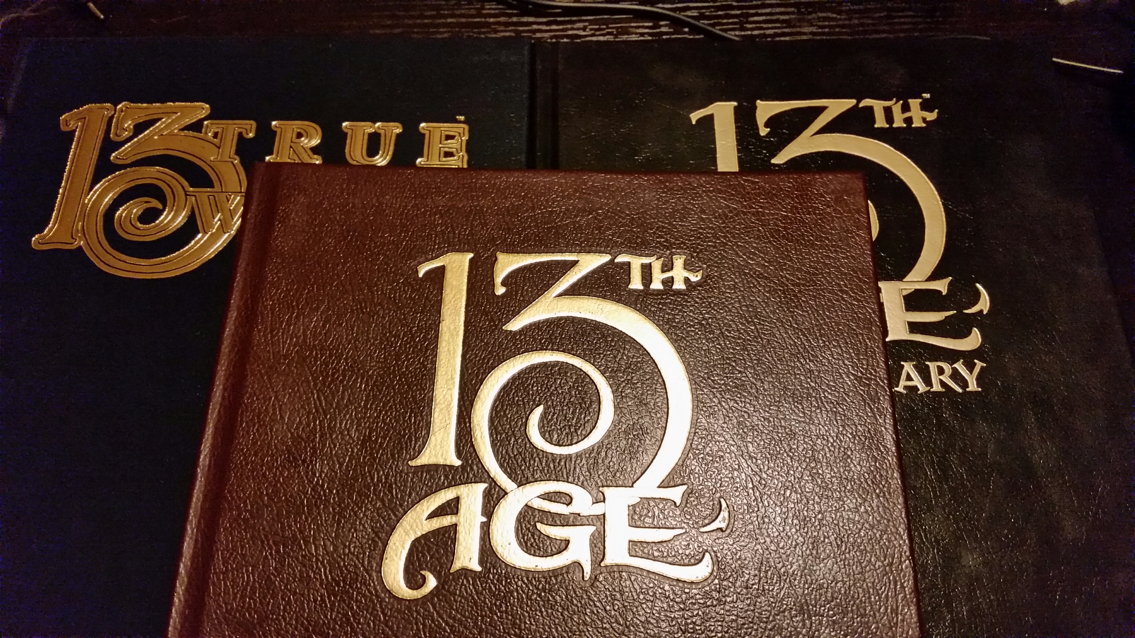 The Holy Trinity of 13th Age limited edition books